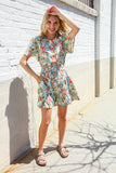 Get Whimsical Tropical Print Smocked Waist Neck Button Romper