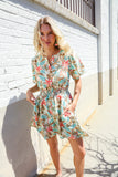 Get Whimsical Tropical Print Smocked Waist Neck Button Romper