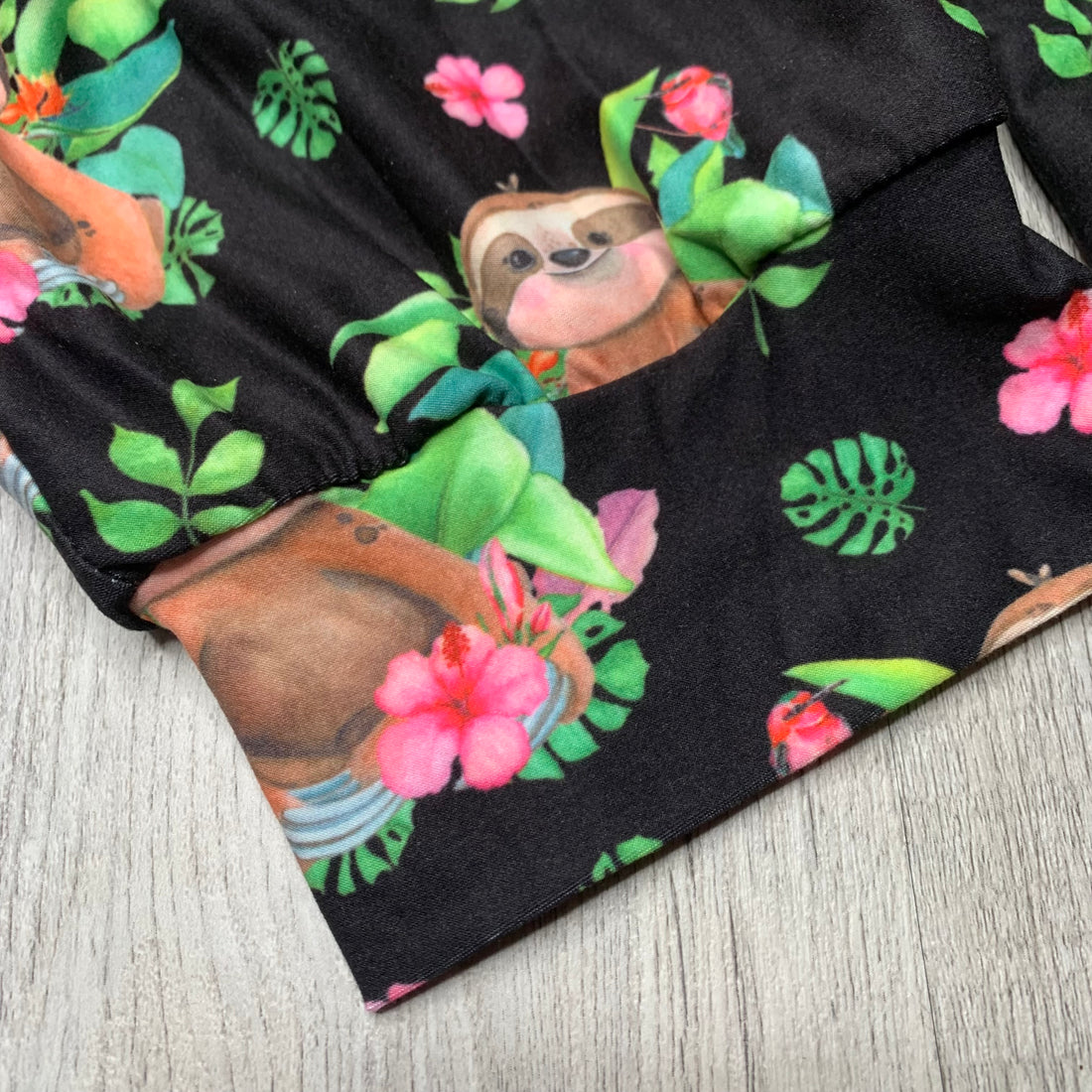 Adorable Sloth w/ Pink Hibiscus Flower Print Capri Black Joggers W/ Pockets